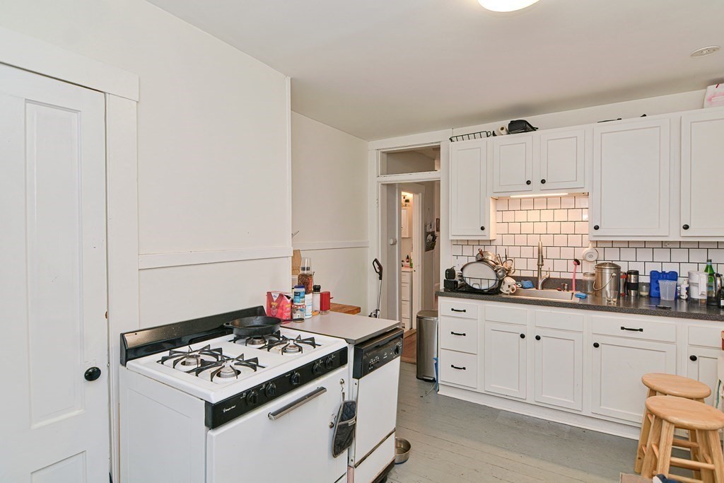 183 Main Street Northampton, MA 01053 - Photo 32 of 42 a kitchen with stainless steel appliances cabinets and a window