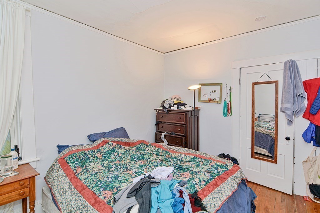 183 Main Street Northampton, MA 01053 - Photo 33 of 42 a bedroom with a bed and a table