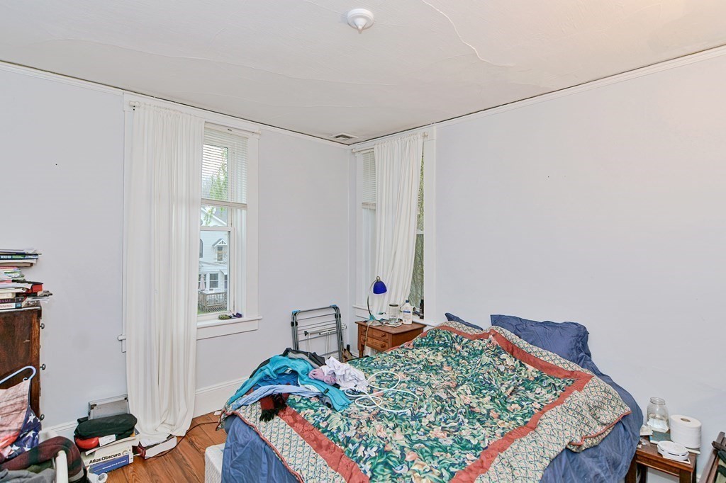 183 Main Street Northampton, MA 01053 - Photo 34 of 42 a bedroom with bed and a window