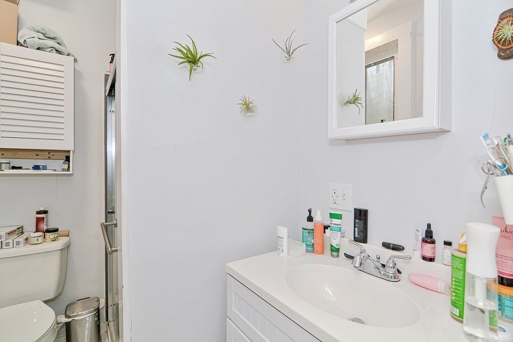 183 Main Street Northampton, MA 01053 - Photo 35 of 42 a bathroom with a sink a toilet and a window
