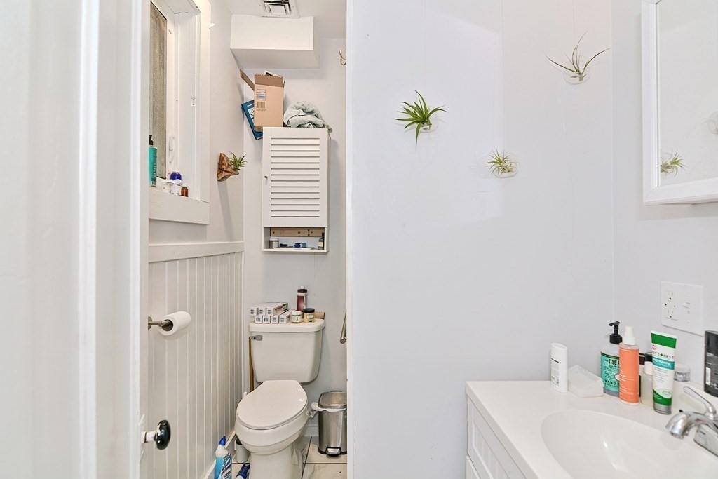 183 Main Street Northampton, MA 01053 - Photo 36 of 42 a bathroom with a sink a toilet and a mirror