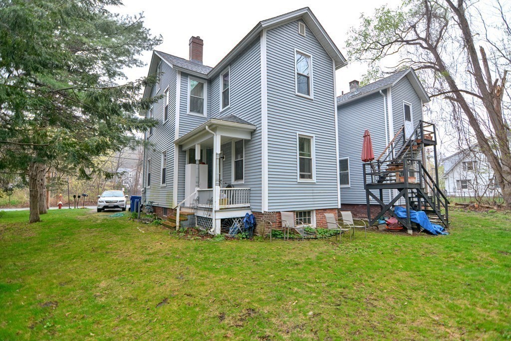 183 Main Street Northampton, MA 01053 - Photo 39 of 42 a view of a house with a yard and sitting area