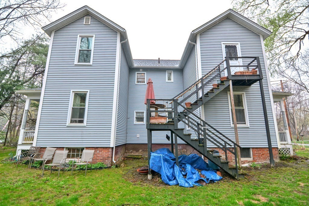 183 Main Street Northampton, MA 01053 - Photo 40 of 42 a front view of a house with a yard