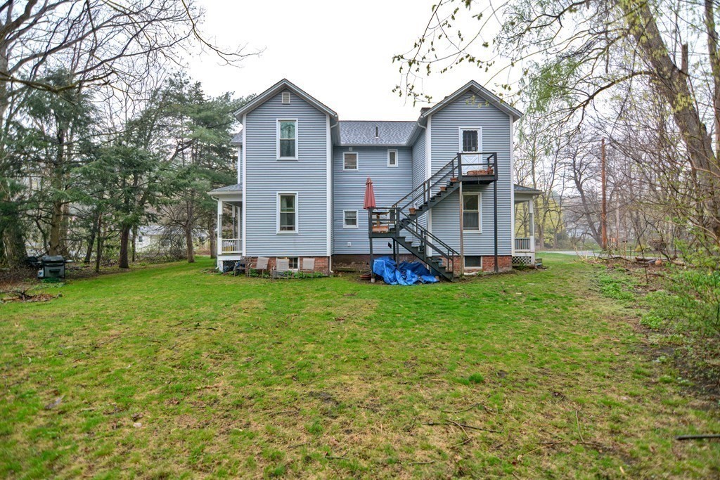 183 Main Street Northampton, MA 01053 - Photo 41 of 42 a front view of house with a garden and swing