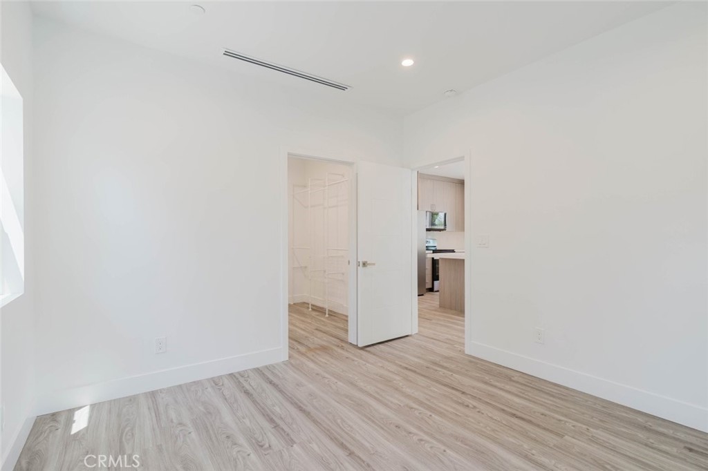 17846 Rinaldi Street Granada Hills, CA 91344 - Photo 21 of 34 a view of hallway with wooden floor