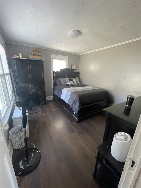 109-111 Dwight Road Springfield, MA 01108 - Photo 11 of 24 a bedroom with a bed and wooden floor