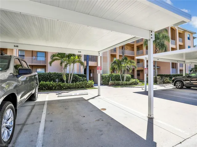 a view of a house with garage and couches
