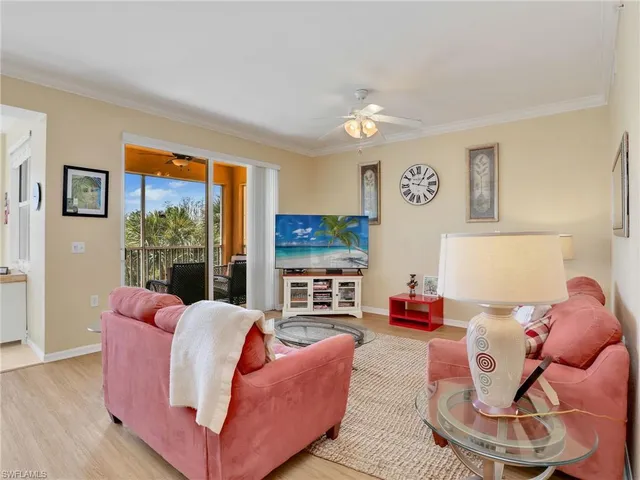 a living room with furniture fireplace and flat screen tv