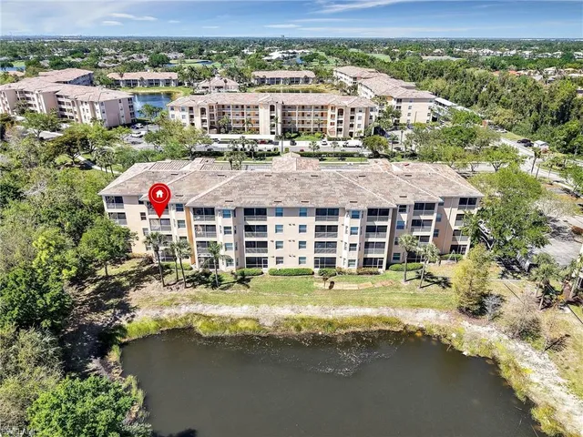 a view of a lake with a building in the background