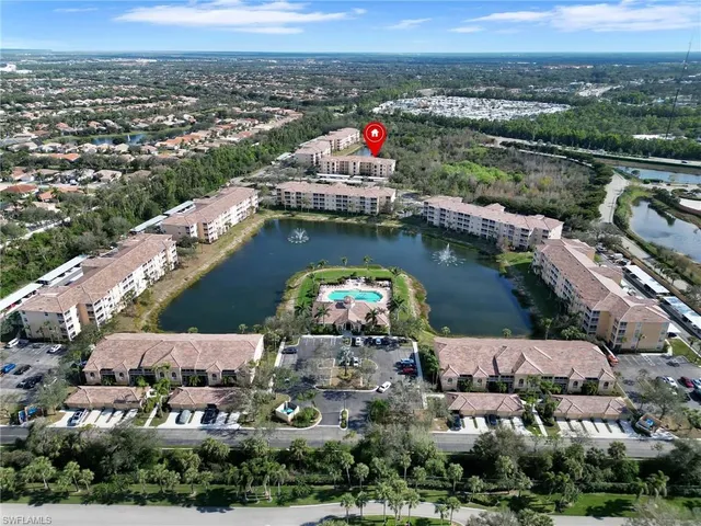 an aerial view of a city with lake view