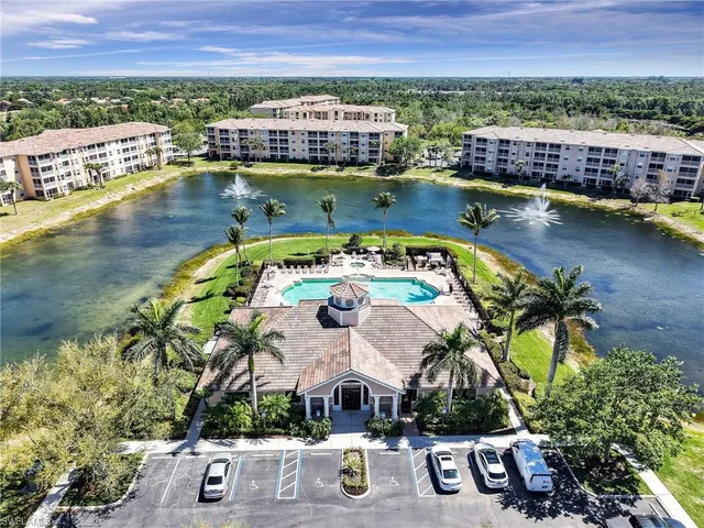 an aerial view of a house with a lake view