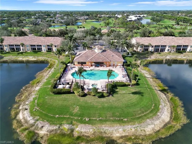 an aerial view of a house with garden space and street view