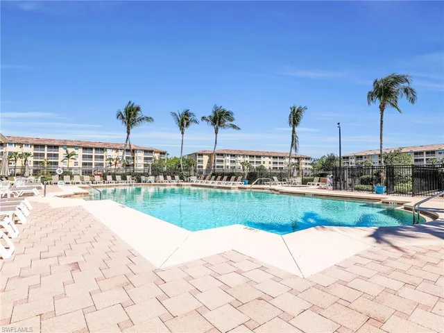 an aerial view of a house with a garden and swimming pool
