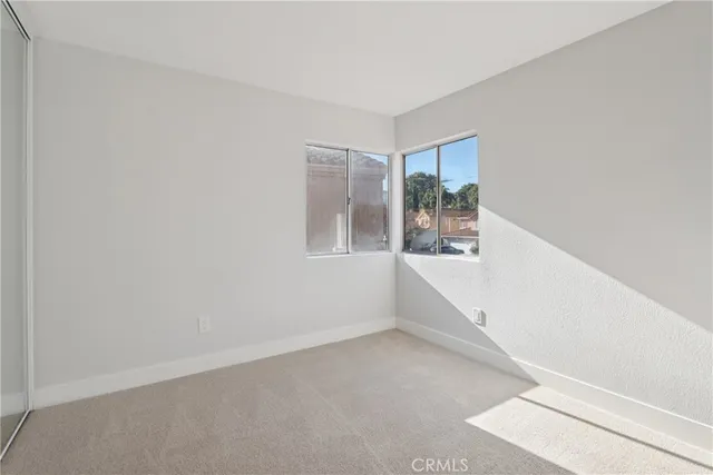 a view of an empty room with windows