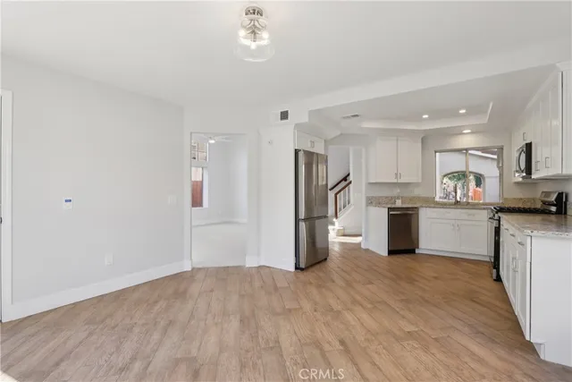 a view of kitchen with wooden floor