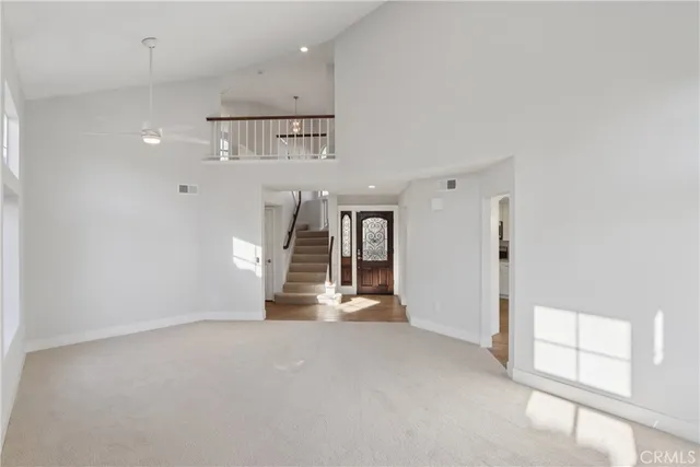 an empty room with windows and pillars in it