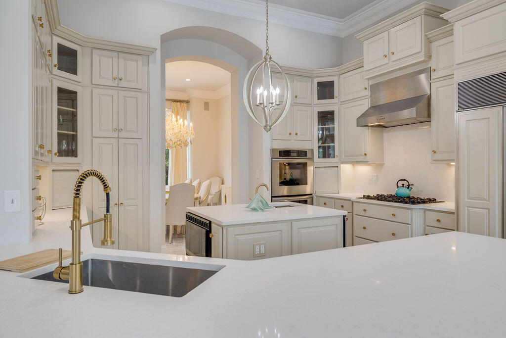 2940 Pine Valley Road Miramar Beach, FL 32550 - Photo 42 of 97 a kitchen with stainless steel appliances a sink a stove and cabinets