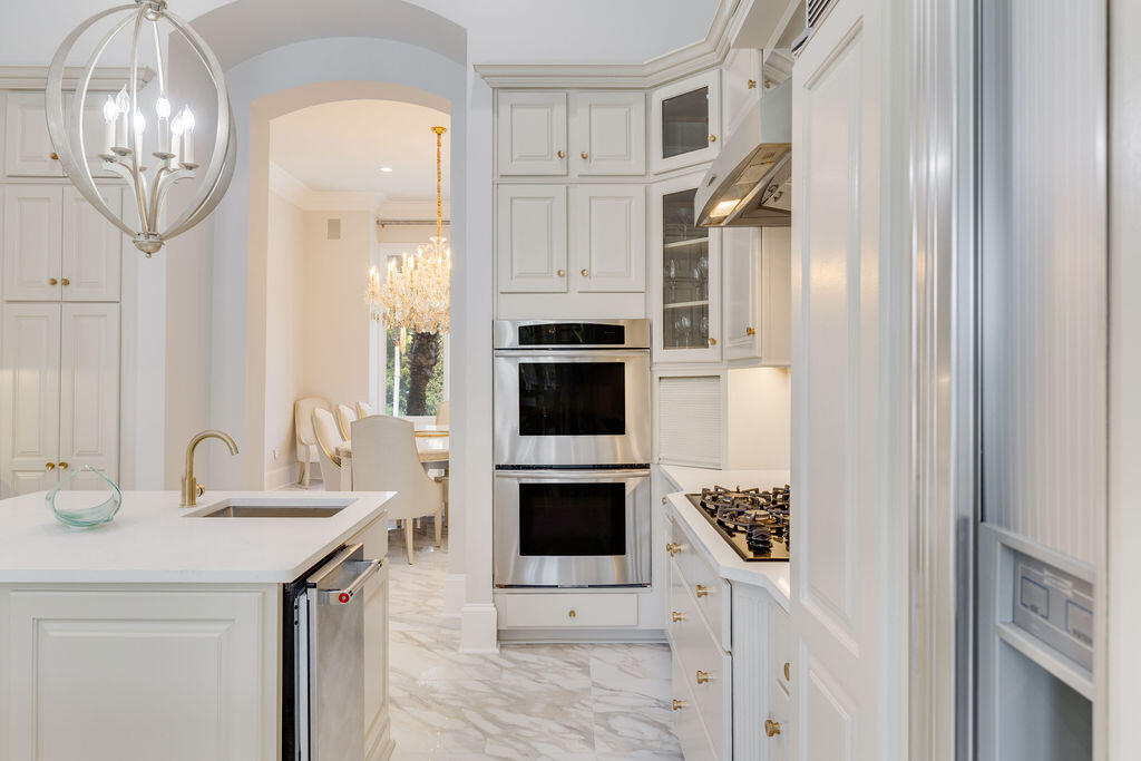 2940 Pine Valley Road Miramar Beach, FL 32550 - Photo 44 of 97 a kitchen with a sink and a fireplace