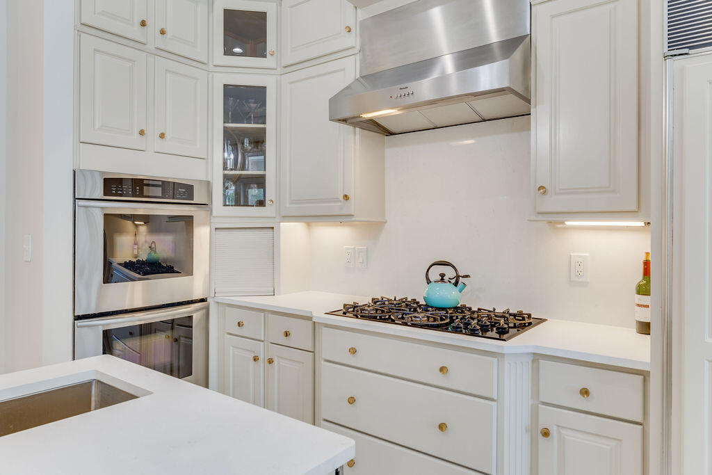2940 Pine Valley Road Miramar Beach, FL 32550 - Photo 45 of 97 a kitchen with stainless steel appliances granite countertop white cabinets and a stove