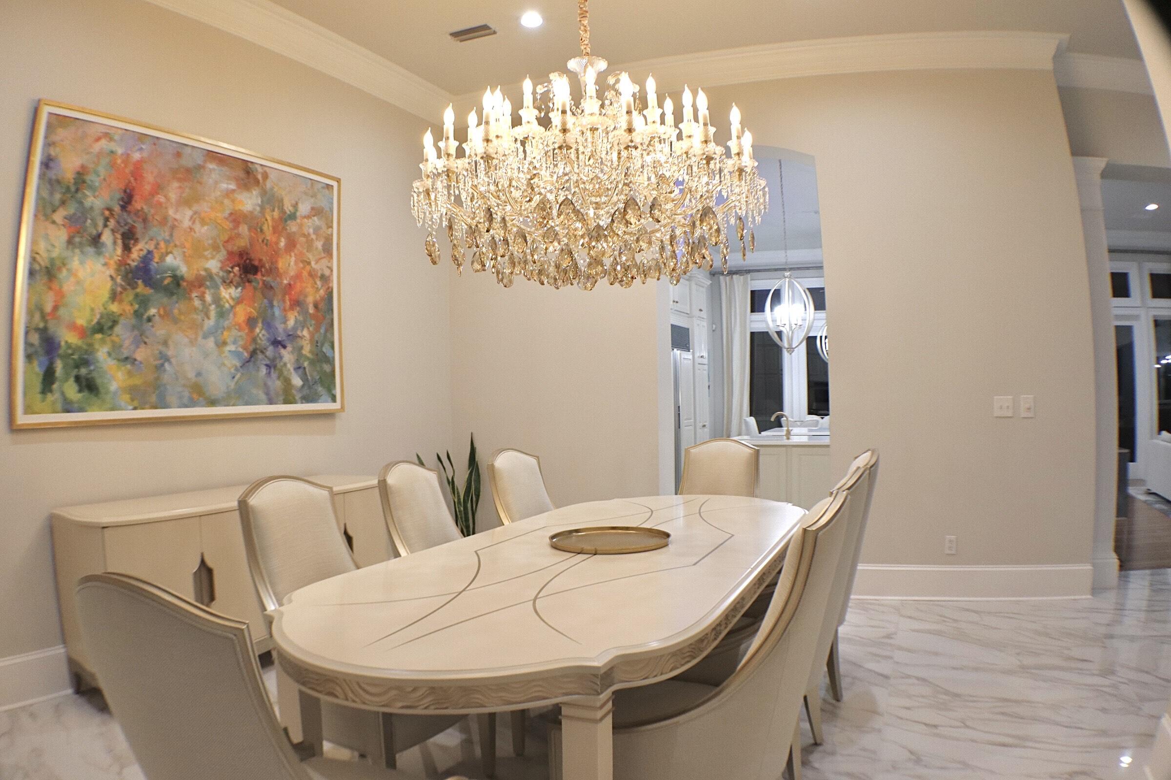2940 Pine Valley Road Miramar Beach, FL 32550 - Photo 49 of 97 a view of a dining room with furniture a chandelier and wooden floor