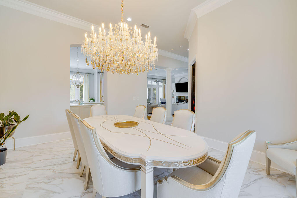2940 Pine Valley Road Miramar Beach, FL 32550 - Photo 52 of 97 a view of a dining room with furniture and chandelier
