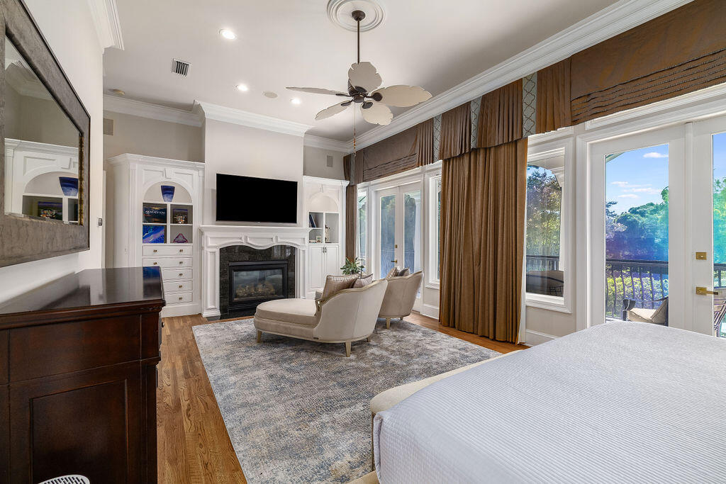 2940 Pine Valley Road Miramar Beach, FL 32550 - Photo 56 of 97 a living room with furniture a fireplace and a flat screen tv