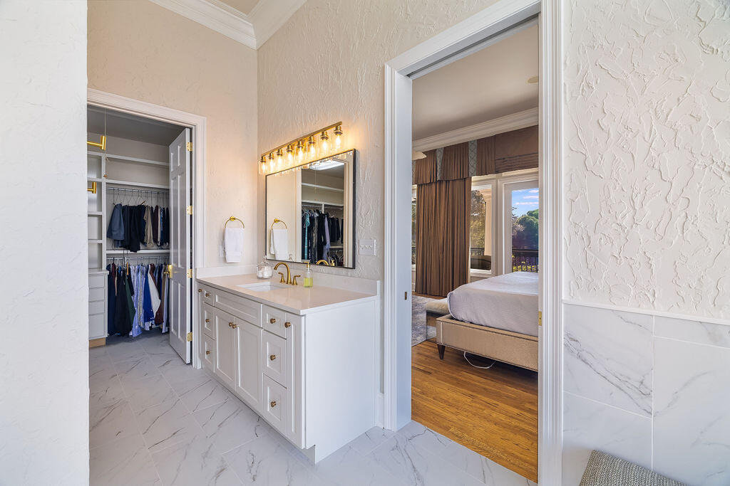 2940 Pine Valley Road Miramar Beach, FL 32550 - Photo 64 of 97 a en suite bathroom with a sink and a mirror