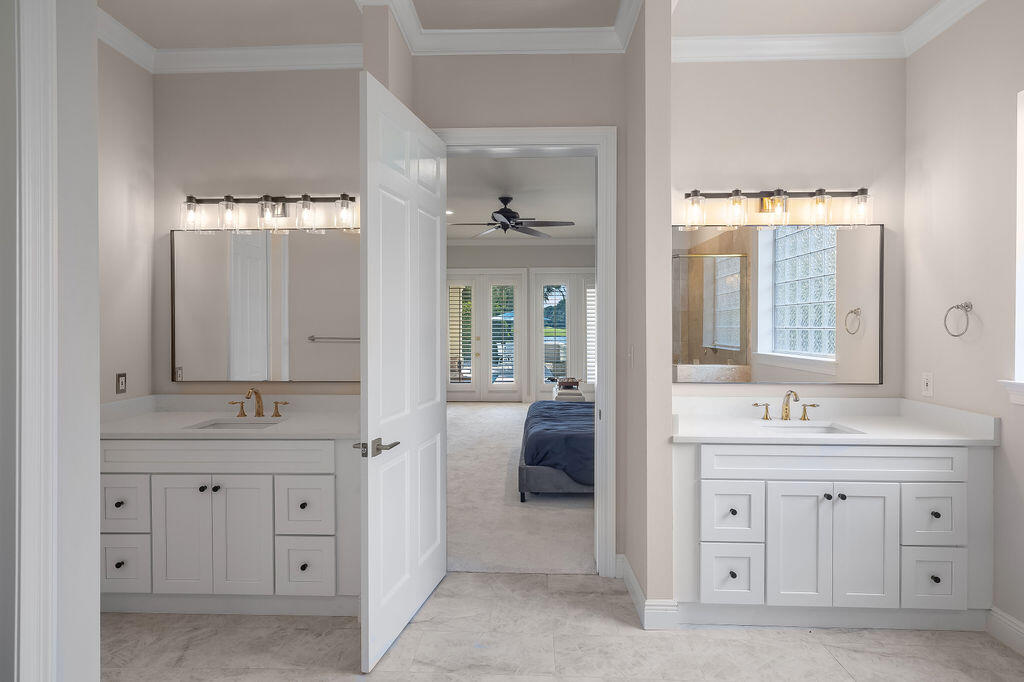 2940 Pine Valley Road Miramar Beach, FL 32550 - Photo 76 of 97 a bathroom with a double vanity sink and mirror with shower
