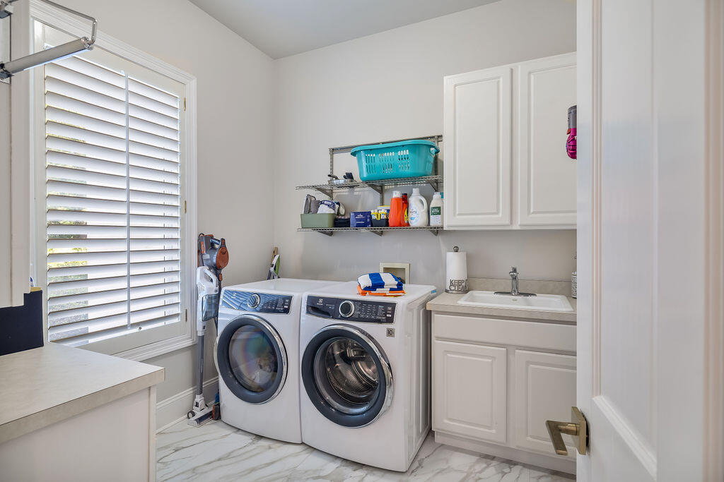 2940 Pine Valley Road Miramar Beach, FL 32550 - Photo 83 of 97 a utility room with sink dryer and washer