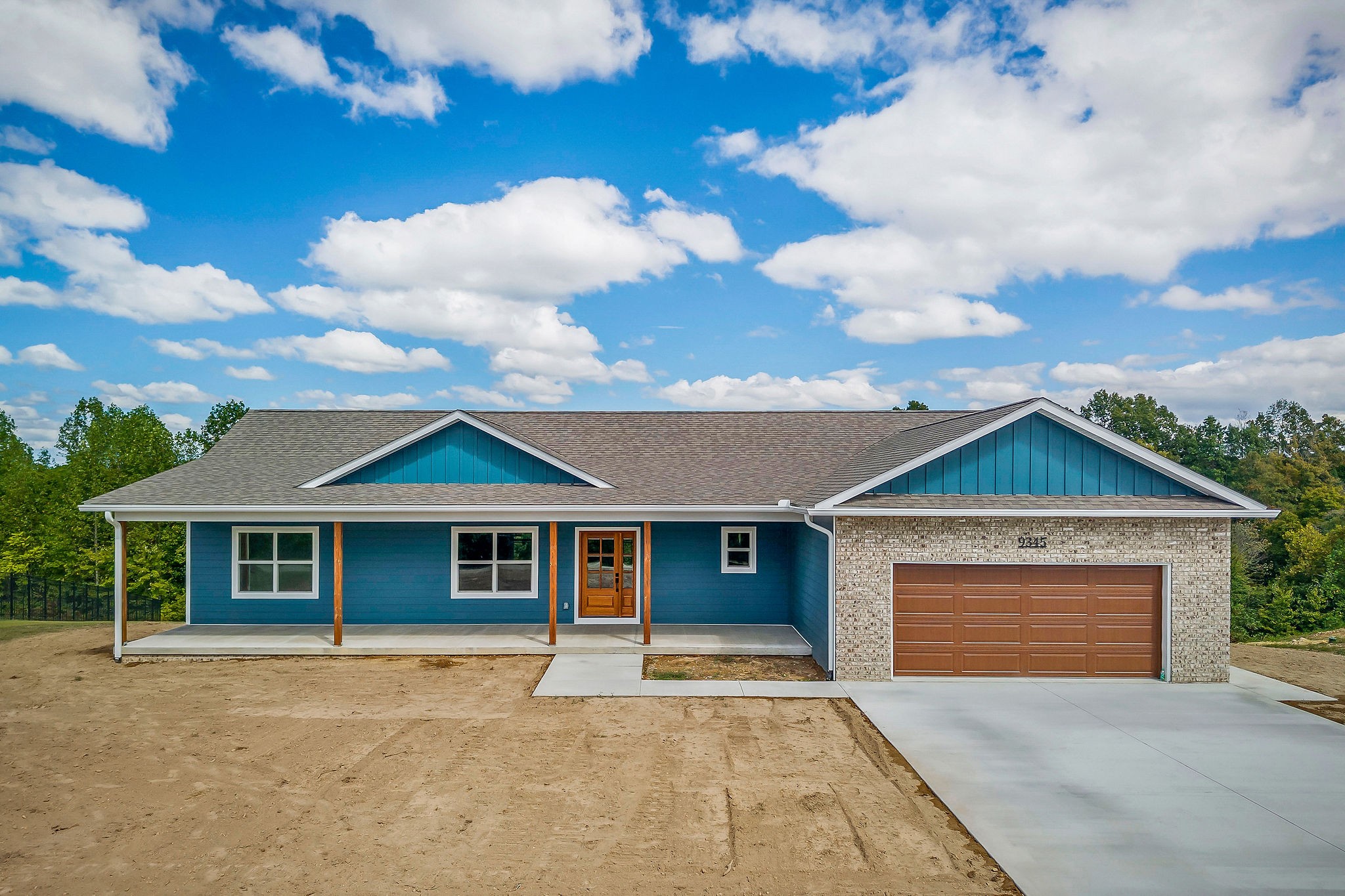 a front view of a house with a garage