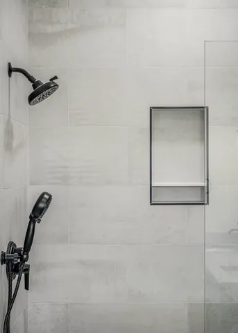 a bathroom with a granite countertop sink mirror and double