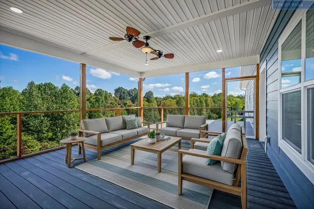 a view of outdoor space with wooden floor and windows