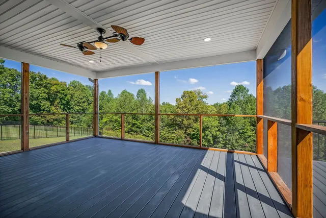 a view of balcony with wooden floor