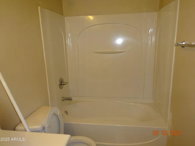 a bathroom with a shower and a bathtub