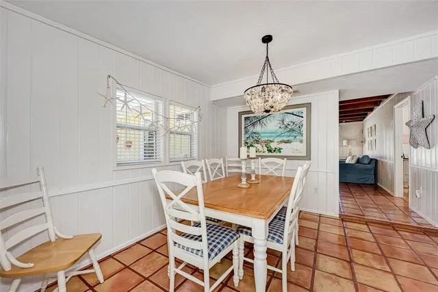 a bedroom with bed and wooden floor