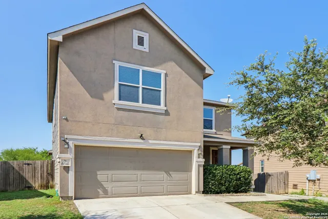 a front view of a house with a garage