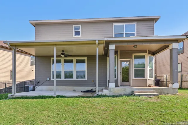 a view of a backyard with trampoline