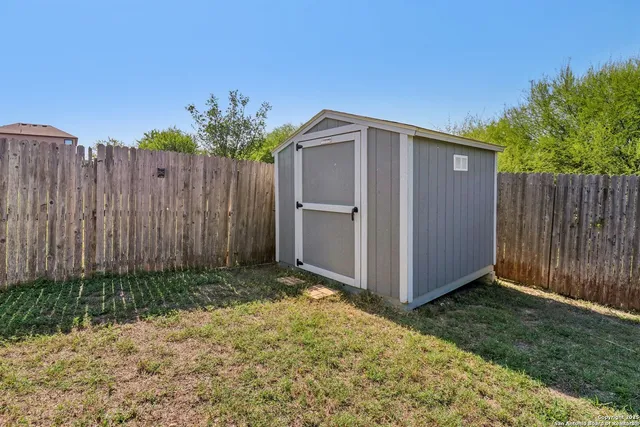 a view of swimming pool with a backyard