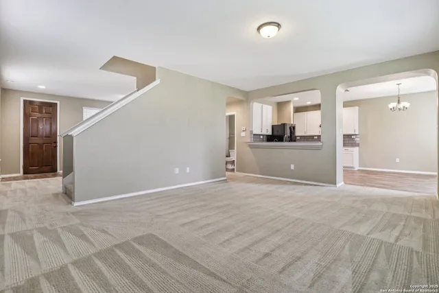 a view of a kitchen with a sink and a stove top oven