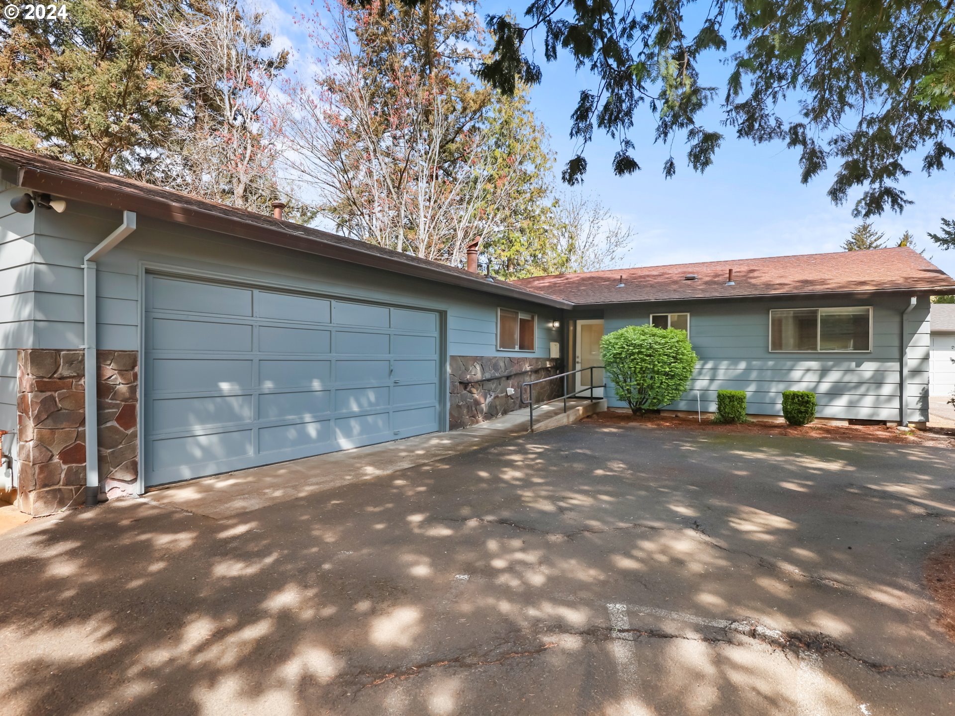 a view of a house with a tree