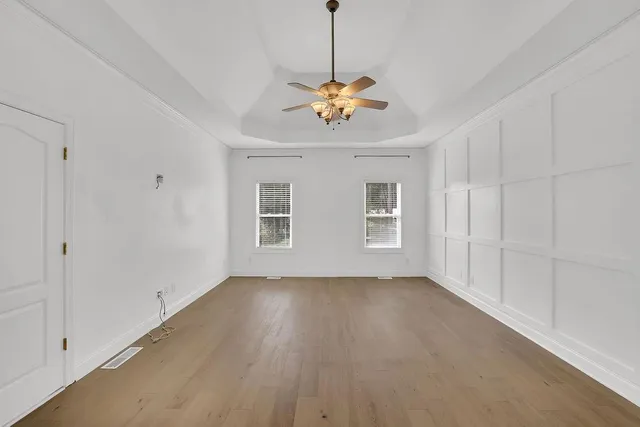 a view of room with window and ceiling fan