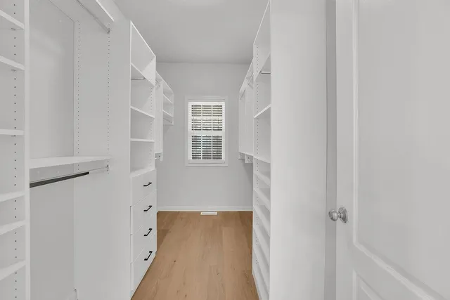 a view of a hallway with windows