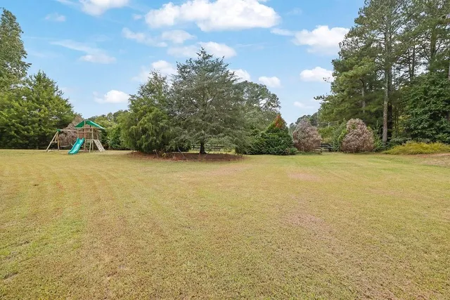 a view of a ocean with trees in the background