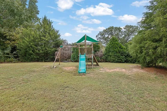 a backyard of a house with lots of green space