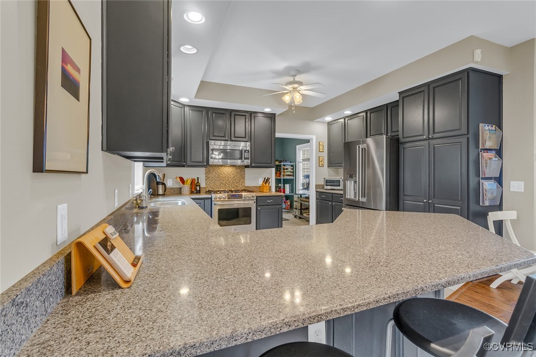 324 Potomac Drive Heathsville, VA 22473 - Photo 17 of 50 a kitchen with stainless steel appliances granite countertop a sink refrigerator and cabinets