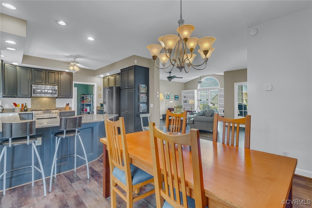 324 Potomac Drive Heathsville, VA 22473 - Photo 21 of 50 a dining room filled chandelier and kitchen view