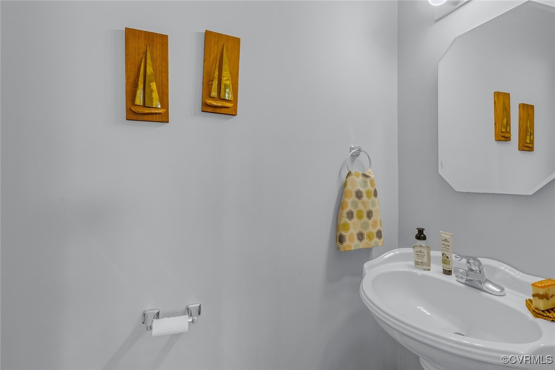 324 Potomac Drive Heathsville, VA 22473 - Photo 22 of 50 a bathroom with a sink mirror and vanity