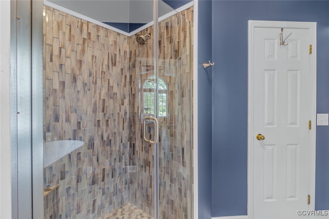 324 Potomac Drive Heathsville, VA 22473 - Photo 28 of 50 a bathroom with a shower and a curtain