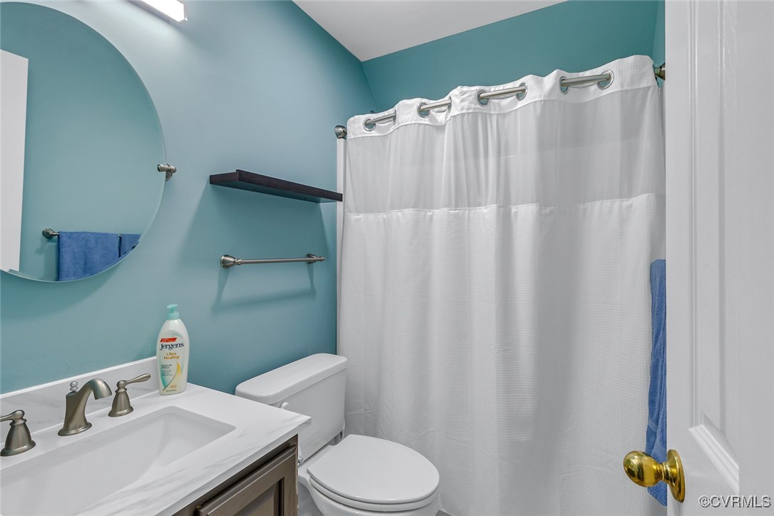 324 Potomac Drive Heathsville, VA 22473 - Photo 35 of 50 a white toilet sitting next to a bathroom sink