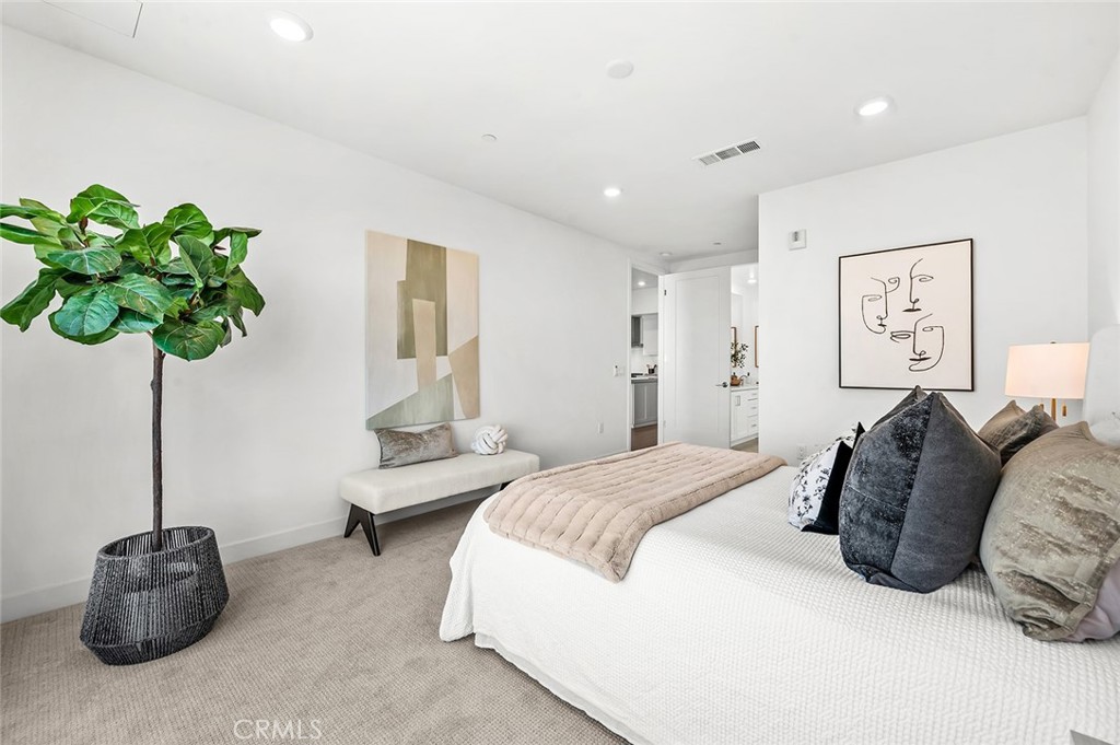 3604 Rivington Irvine, CA 92612 - Photo 19 of 54 a bedroom with a bed and a potted plant